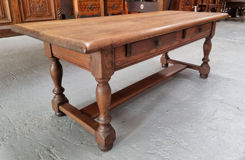 Fabulous Rustic French Oak coffee table with two drawers. It is in good original detailed condition.