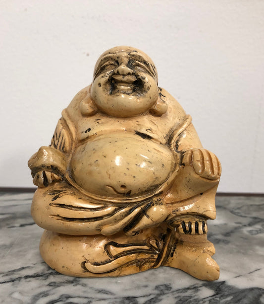 Vintage carved statue of Smiling Buddha