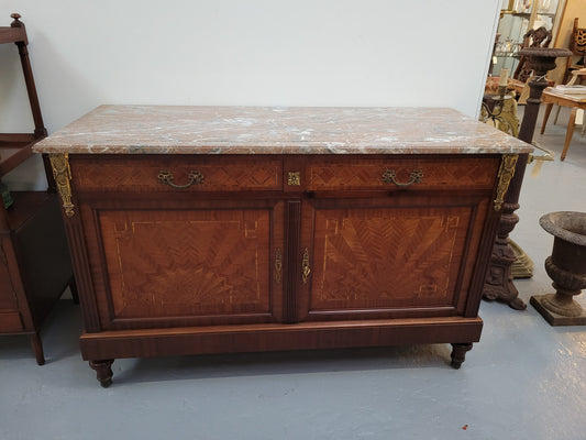 Louis 16th style Mahogany marble top cupboard and two drawers with decorative marquetry inlay and gilt bronze mounts. In good original detailed condition.