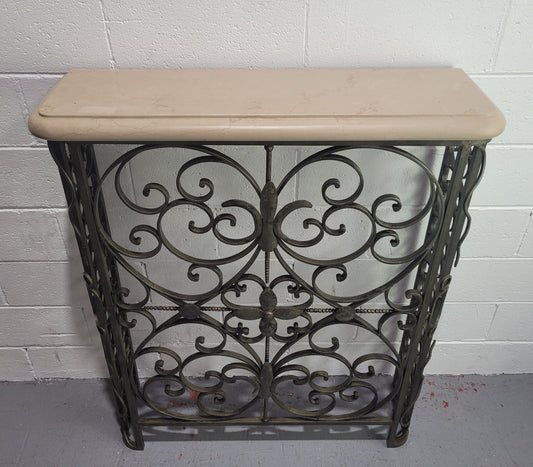 Stunning Art Deco wrought iron and marble top console table. It has amazing decorative iron work at the bottom and a beautiful marble top. It is in good original detailed condition.