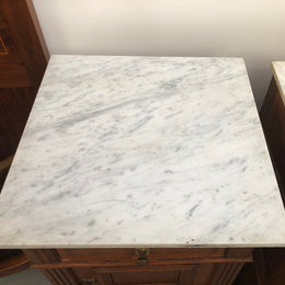 A lovely pair of French Oak, marble top bedside cabinets with a cupboard and drawer in good original condition.