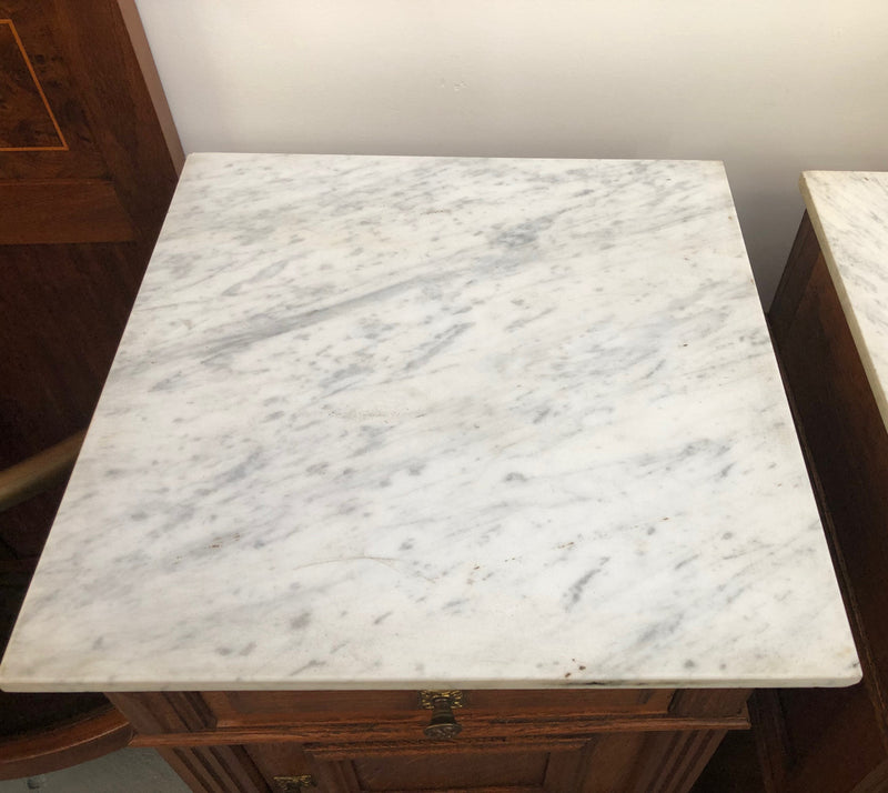 A lovely pair of French Oak, marble top bedside cabinets with a cupboard and drawer in good original condition.