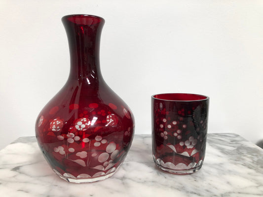 Vintage flash ruby glass water carafe with matching drinking glass.