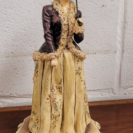 Vintage Italian figurine of lady holding umbrella signed. Sourced locally and in good original condition, please view photos as they help form part of the description.