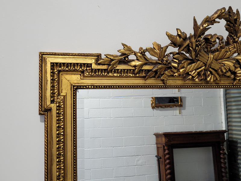 Substantial Louis XI style French Antique over mantel mirror. It is in very good restored condition.