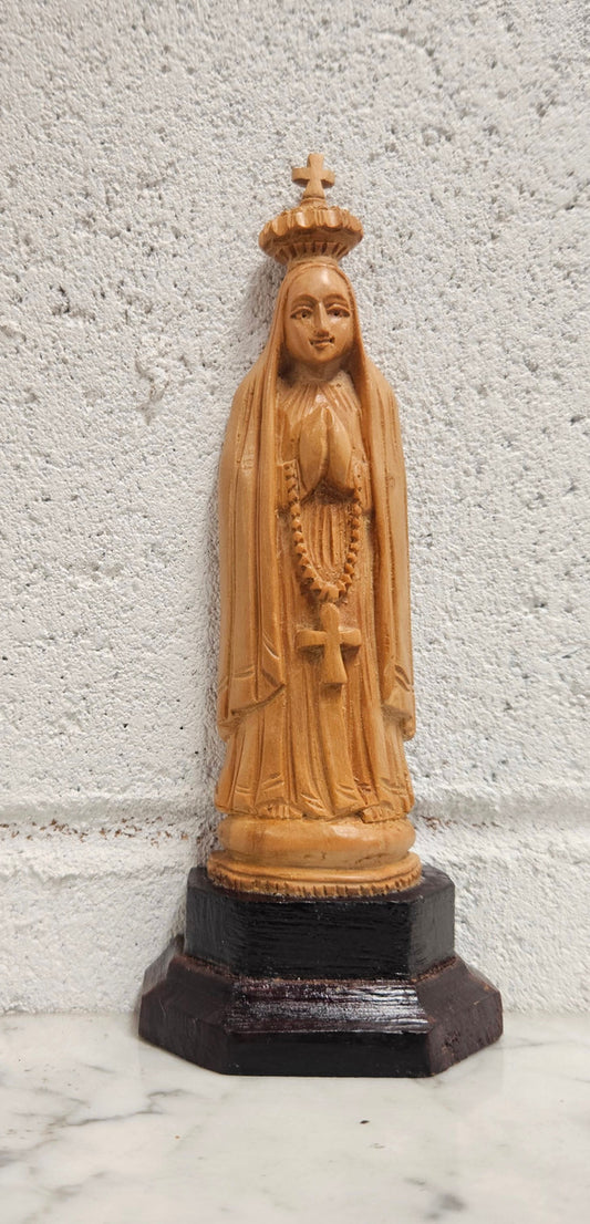 Vintage Olivewood statue of praying Virgin Mary on dark wooden plinth. Condition comensurate with age, please view photos as they help form part of the description.