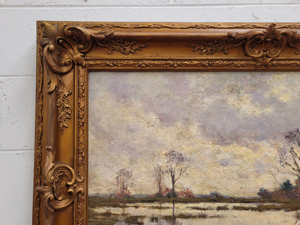 Sourced from France an impressionist oil painting of a beautiful lake scene. It is nicely framed in an Antique frame and in good original detailed condition.
