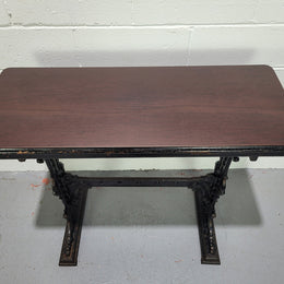 Late Victorian English Mahogany and cast iron base pub table. The foundry maker name is on the base and it is in good original detailed condition.