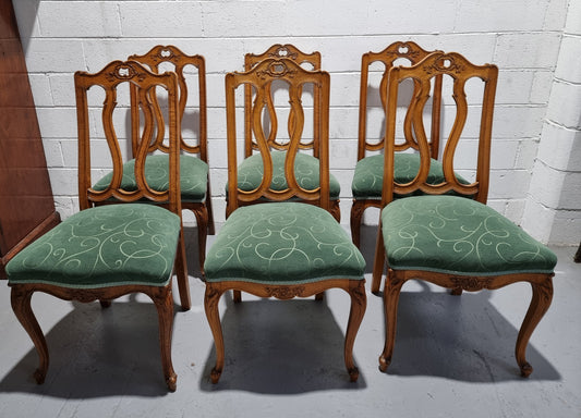 Set of six French style Oak decorative upholstered seat dining chairs. They are comfortable to sit in and are in good original condition, please view photos of fabric as the fabric is in good used condition.