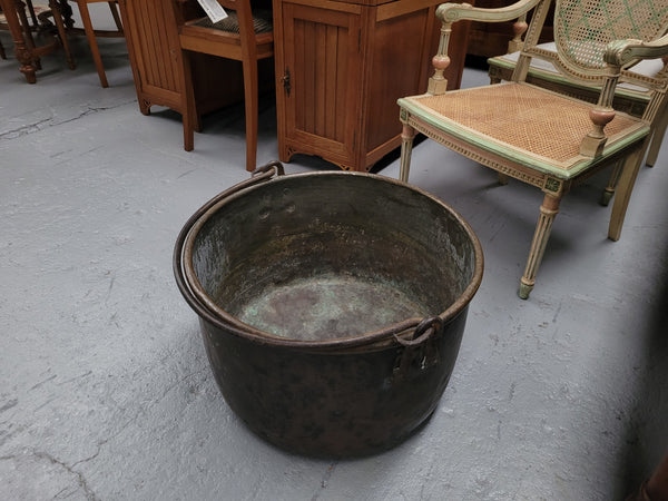 Sourced in France is this large Antique French brass firewood pot with handle. It is in original condition with some signs of wear please view photos.