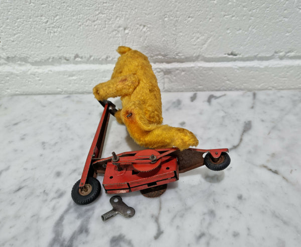 "Gebruder Fendi" bear riding scooter wind up toy, comes with original key. In good original condition, please view photos as they help form part of the description.