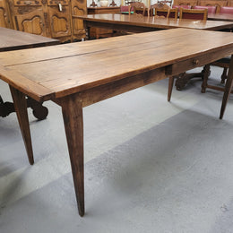 Provincial 19th Century French Oak rustic farmhouse table with tapered leg and single drawer. It has been sourced from France and is in good original detailed condition. 