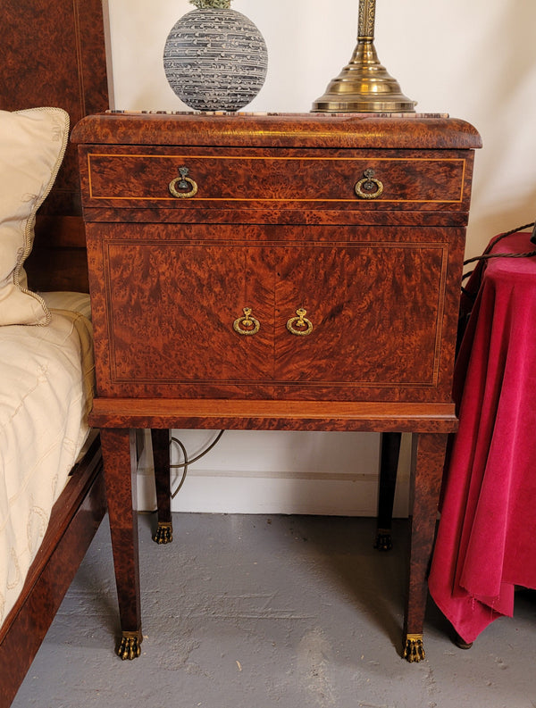 French Art Deco bedroom suite consisting of queen size bed in Amboyna wood and featuring pretty inlay. It comes with a matching pair of bedsides. It is a very stylish and high quality suite. It has been sourced from France and is in good original detailed condition.