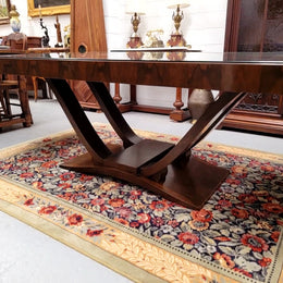 French Art Deco Figured Walnut dining table and six chairs. This stylish table also comes with a glass top and can be used with or without it. The chairs are very comfortable and the table can also fit another two chairs at either end making it a 6-8 seater. The table is in good original detailed condition with character marks to the top of table as shown in the pictures. This table and six chairs have been sourced locally.