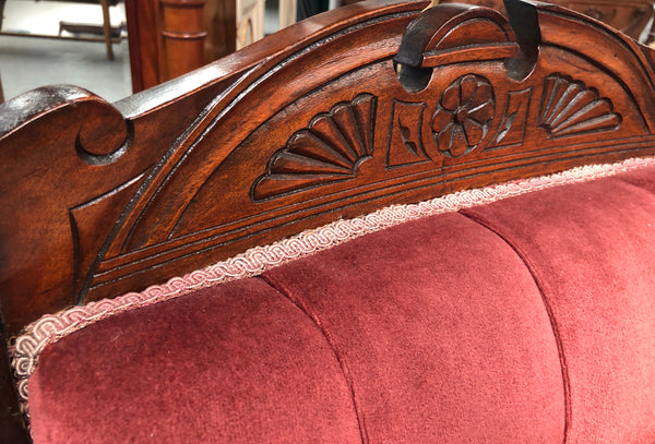 Beautiful pair of carved Edwardian arm chairs with lovely pink upholstery with button backs. In good condition.