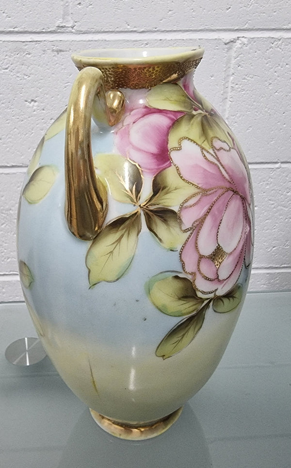 Lovely hand painted double handled vase in great original condition. Please see photos as it forms part of the description.