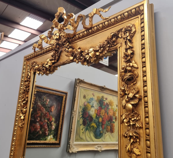Stunning Vintage French floral gilt framed overmantel mirror. It has been sourced from France and is in good original detailed condition.