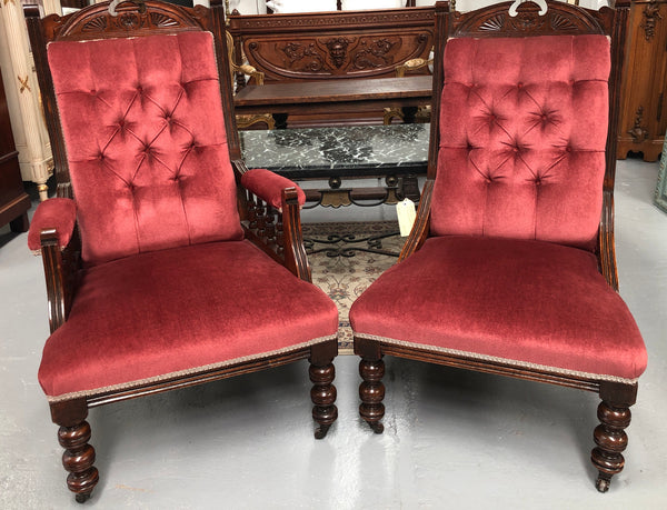 Beautiful pair of carved Edwardian arm chairs with lovely pink upholstery with button backs. In good condition.