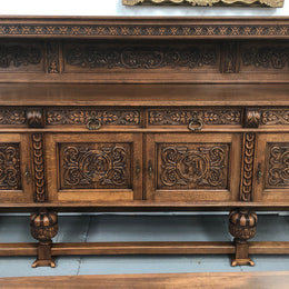 French Oak beautifully carved Renaissance style sideboard with four drawers. Beautiful wax finish and is in good original detailed condition.