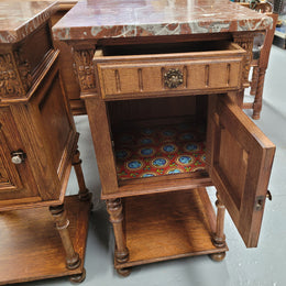 Pair French Oak Henry II style rouge marble topped bedside cabinets. Consisting of one drawer, one cupboard and a bottom shelf. Carved decoration and turned legs. Circa: 1900's.