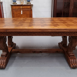 Amazing French Oak Renaissance style parquetry top extension table. Beautiful parquetry top and amazing detailed carvings on the legs. It extends to 306 cm long when fully extended. Sourced from France and in good original detailed condition.