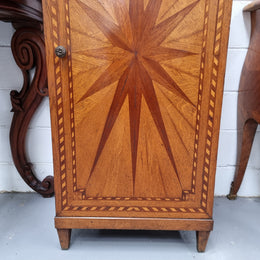 French Art Deco inlaid Oak curio/side cabinet with a lift up top and glass underneath. There are two fixed shelves, two adjustable shelves and one hidden drawer. Sourced from France and in good original condition.
