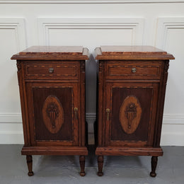 Pair of French Art Deco Oak and rouge inset marble top bedside cabinets. They have one drawer and one cupboard with elegant carving on the door. They have been sourced from France and are in good original detailed condition.