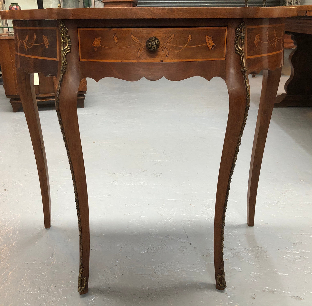 Stunning small inlaid French Walnut Louis XV style hall table with ormolu mounts and beautiful details. It has been sourced from France and is in good orignal detailed condition.