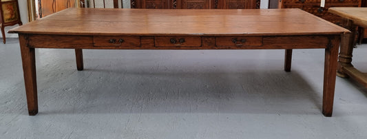 Amazing 19th Century French Oak Farmhouse style dining table with three drawers. It is made from three large planks of wood which is very hard to find. It is also very wide with a width of 105.5 cm. It is in good original detailed condition.