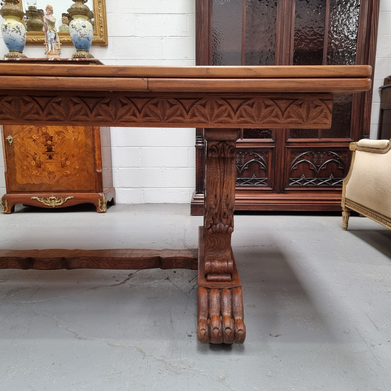 Amazing French Oak Renaissance style parquetry top extension table. Beautiful parquetry top and amazing detailed carvings on the legs. It extends to 306 cm long when fully extended. Sourced from France and in good original detailed condition.