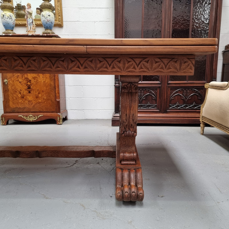 Amazing French Oak Renaissance style parquetry top extension table. Beautiful parquetry top and amazing detailed carvings on the legs. It extends to 306 cm long when fully extended. Sourced from France and in good original detailed condition.