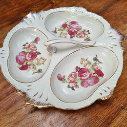 Vintage ceramic three sectional floral bowl with handle and gilt rim. Stamped underneath and in good original condition with no chips or cracks. Please view photos as they help form part of the description.