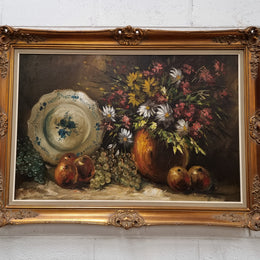 Beautiful signed oil on canvas of a still life framed in an ornate frame. Sourced in France and in good original condition.