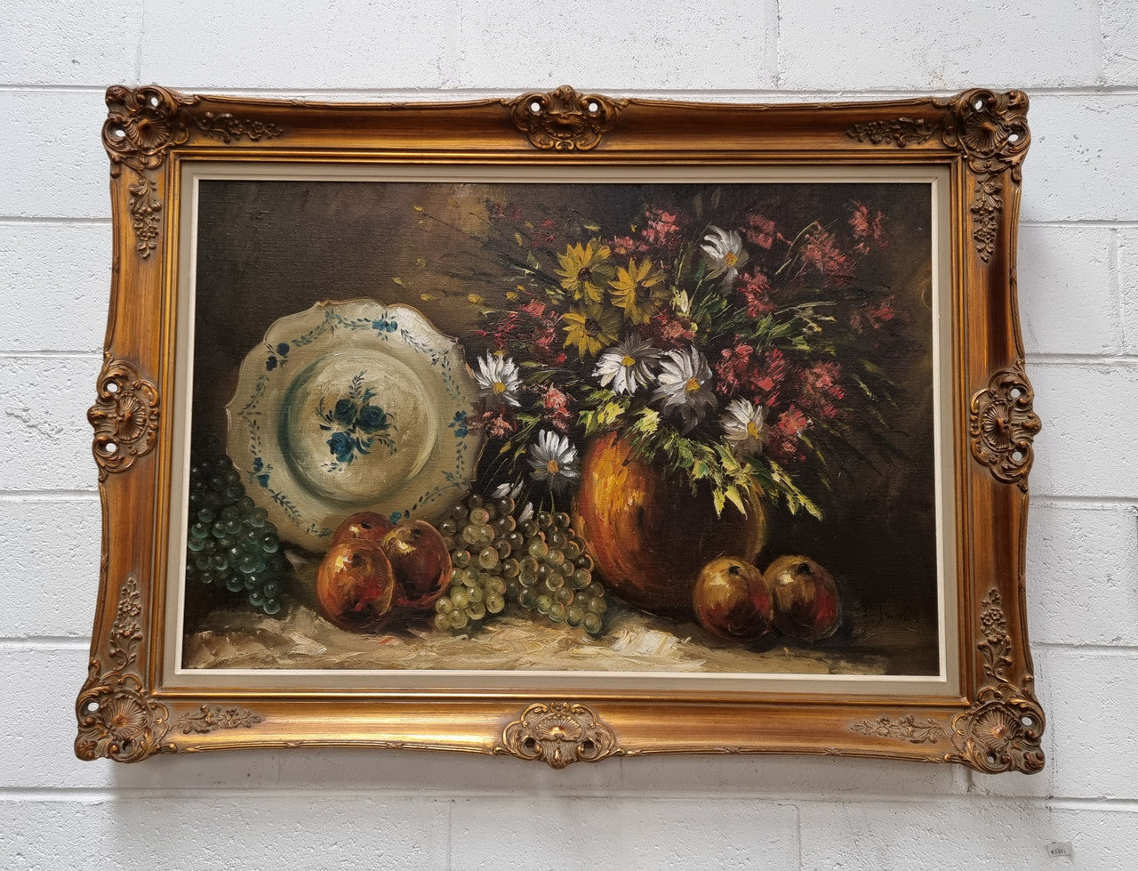 Beautiful signed oil on canvas of a still life framed in an ornate frame. Sourced in France and in good original condition.