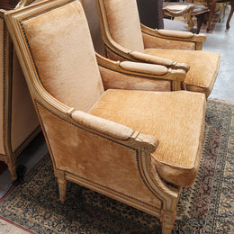 Pair of Louis XVI style painted arm chairs with carving & fluted legs. They have been sourced from France and the fabric is in good used original condition. Please view photos as they help form part of the description.