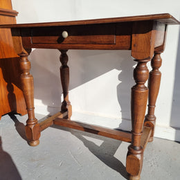 Rustic French Oak side table or desk with single drawer and turned legs. In good original detailed condition.