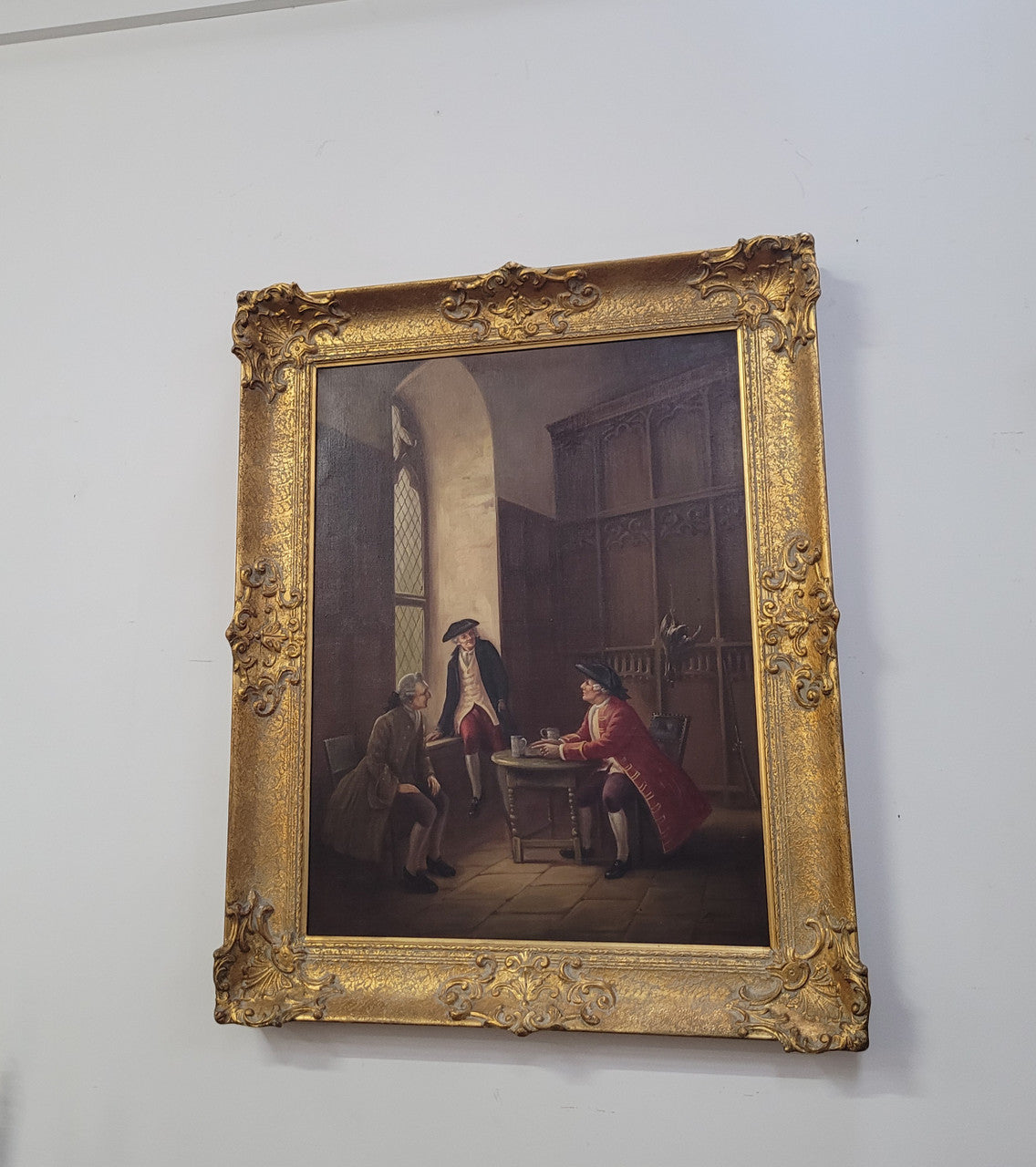 An engaging gilt framed signed oil on canvas of a "French Interior Scene". It has been sourced from France and is in good original detailed condition.