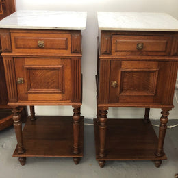 A lovely pair of French Oak, marble top bedside cabinets with a cupboard and drawer in good original condition.