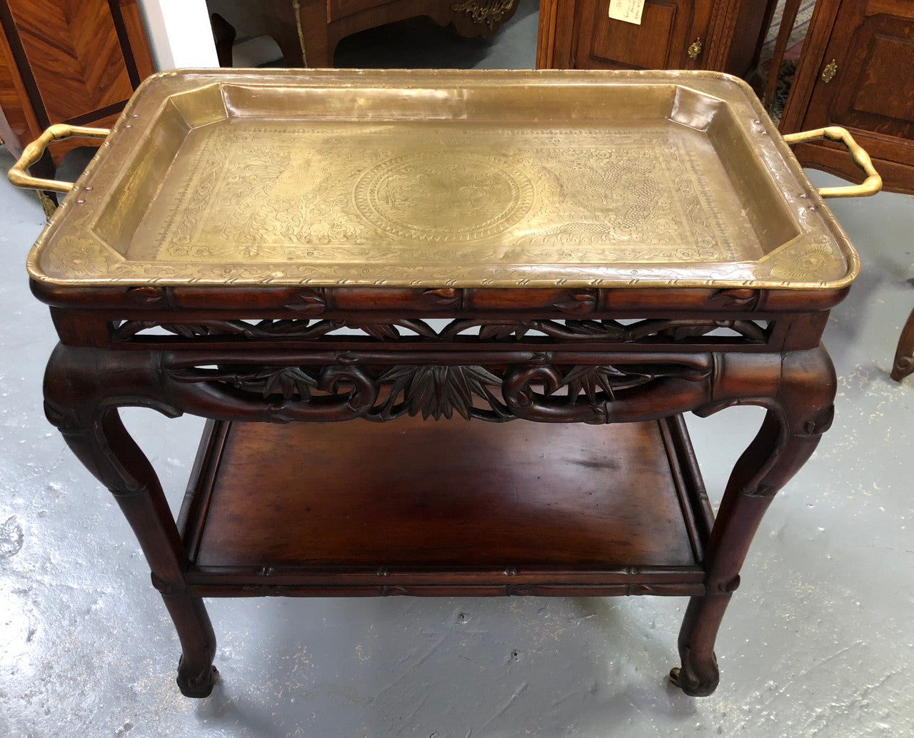 Victorian Rosewood auto/drinks trolley with a very decorative removable brass tray. In very good original detail condition.