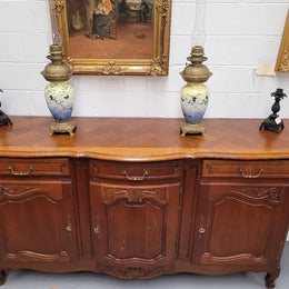 French Oak Louis XV style three drawer three door parquetry top sideboard. It has been sourced from France and is in good original detailed condition.