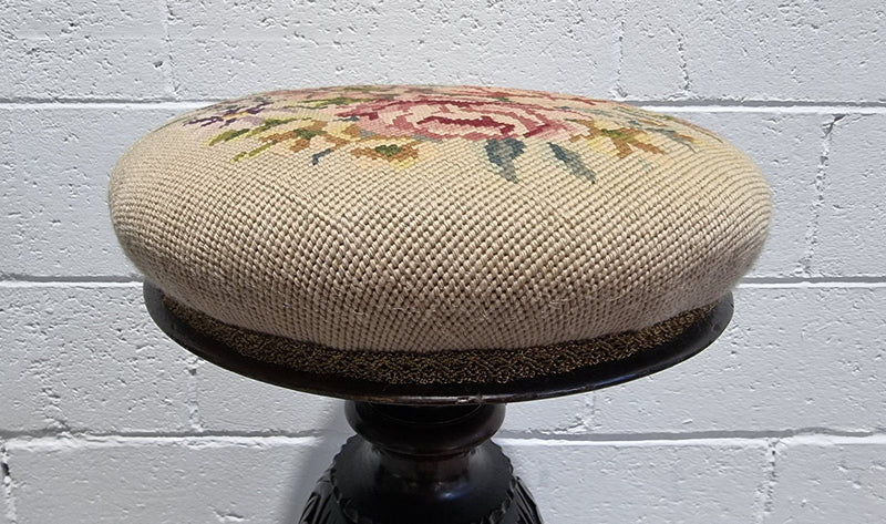 Beautiful Late Victorian Floral tapestry covered revolving piano stool. It is in very good original detailed condition. It has a original David Jones label underneath .