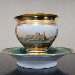 “Old Paris Porcelain” large cup and saucer with hand painted river landscape featuring castles. Gilt and enamel decoration. Circa: early 19th Century. In good original condition please view photos as they help form part of description.