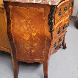 Antique French Louis XV style compact three drawer marble top commode with marquetry inlay and ormolu mounts. Sourced from France and in good original detailed condition.
