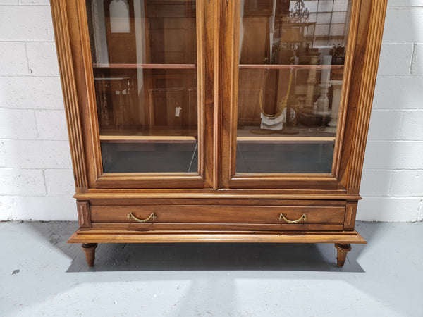 Stunning French Henry II style Walnut two door bookcase. In good original detailed condition.