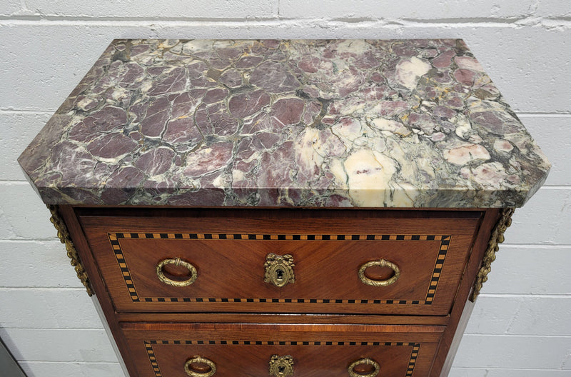 Louis XIV style tall chest of five drawers with stunning marble top. It is of small proportions and has very nice mounts and handles. In good original detailed condition.