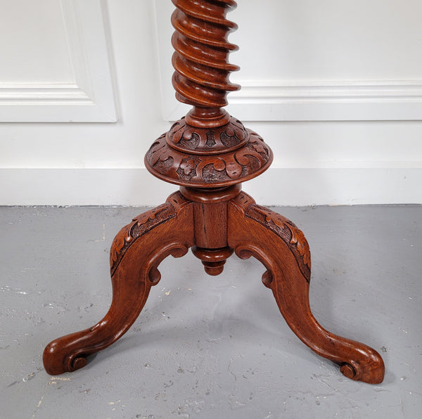 Rare early Victorian Irish Burr Walnut wine table. It has a beautiful carvings and a stunning burr walnut top, on a barley twist column and three shaped legs. It has been sourced locally and is in good original detailed condition. We also have a second table being sold separately which when together make a matched pair.