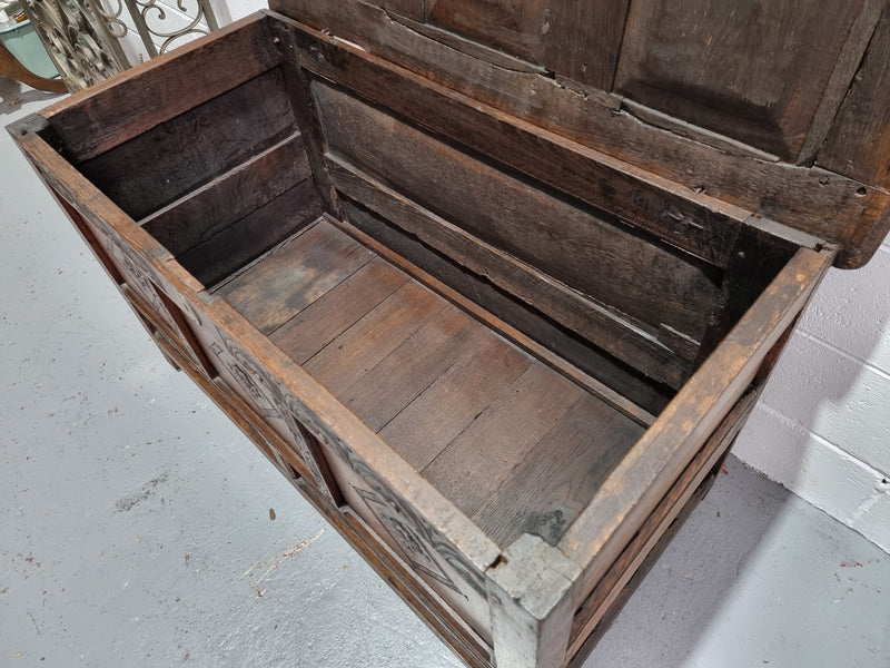 Early 19th Century French Oak carved coffer with a lift up lid for storage. A beautiful piece and in good original condition.