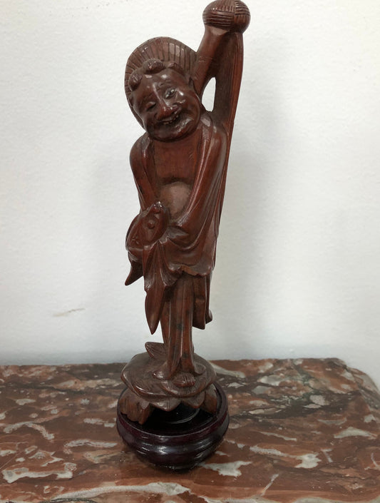 Vintage Chinese carved rosewood figure on wooden stand. In good original condition.