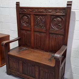 Decorative and nicely carved French Oak 19th Century hall seat with lift up lid for storage. Beautiful details and in good original detailed condition.