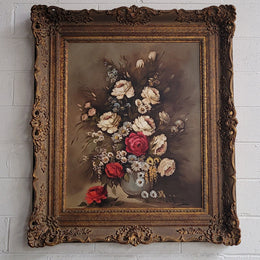 Attractive French floral oil on canvas - signed. Mounted in a stunning patterned gilded frame. It is in good original detailed condition.